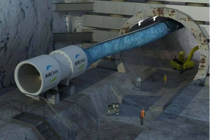 3D render: AIRONN markalı büyük aksiyel vantilatör, mavi esnek hortumla henüz açılmakta olan tünel içine hava basıyor; arka planda ekskavatör ve işçiler